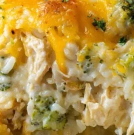 Cheesy broccoli chicken and rice casserole in a baking dish.