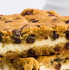 Homemade chocolate chip cheesecake bars on a plate