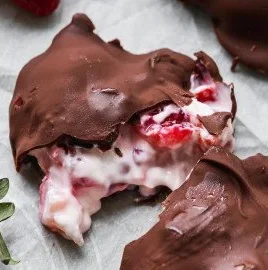 Delicious chocolate strawberry yogurt clusters on a white plate.