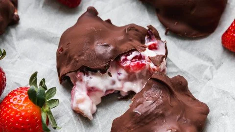 Delicious chocolate strawberry yogurt clusters on a white plate.