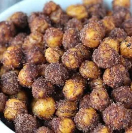 Bowl of delicious cinnamon roasted chickpeas, a healthy snack option.