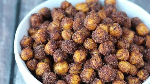 Bowl of delicious cinnamon roasted chickpeas, a healthy snack option.