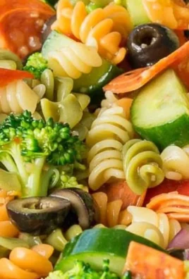 Classic Italian pasta salad with fresh vegetables and herbs.
