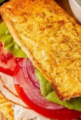 Healthy cottage cheese flatbread topped with fresh herbs and vegetables