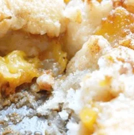 Delicious fresh peach cobbler with juicy peaches and golden crust