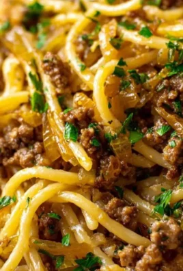 Delicious Garlic Butter Beef Pasta served in a bowl with herbs