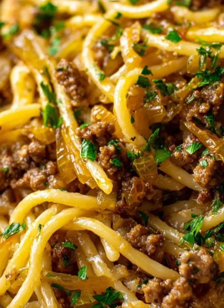 Delicious Garlic Butter Beef Pasta served in a bowl with herbs