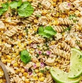 High protein street corn pasta salad with bright ingredients and vibrant colors