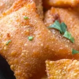 Homemade pizza rolls filled with cheese and pepperoni, served on a plate.