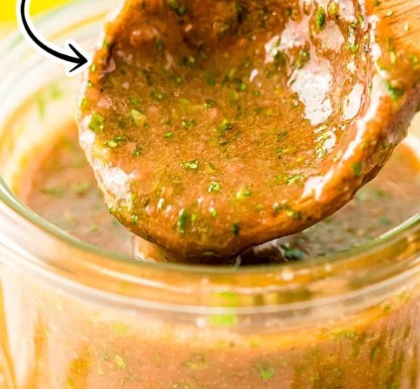 Marinated grilled chicken with Italian herbs and spices on a barbecue grill