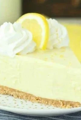 Delicious no-bake lemon cream pie topped with whipped cream and lemon zest.