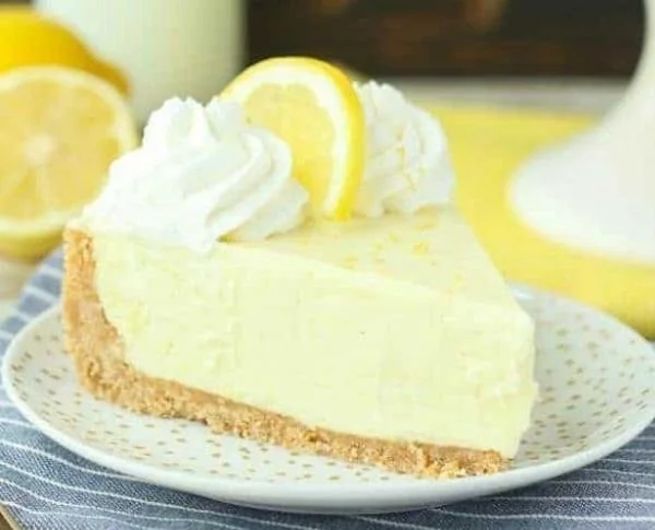 Delicious no-bake lemon cream pie topped with whipped cream and lemon zest.