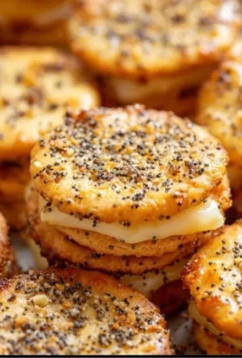 Ritz cracker party sandwiches arranged on a platter, perfect for gatherings.