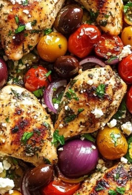 Delicious Sheet Pan Greek Chicken with colorful veggies on a baking tray