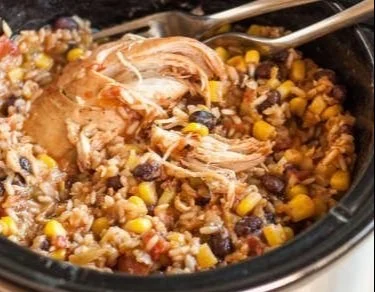 Slow Cooker Chicken Burrito Bowls with seasoned chicken and fresh toppings