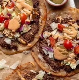 Delicious Smash Burger Tacos with special sauce on a plate