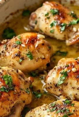 Delicious summer garlic butter baked chicken garnished with herbs.