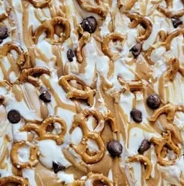 Sweet and Salty Frozen Yogurt Bark topped with nuts and fruits