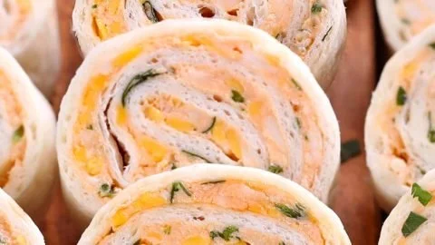 Plate of delicious Taco Tortilla Roll Ups served with dipping sauce