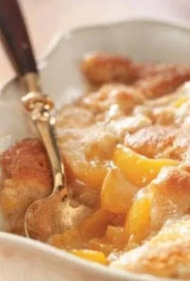 Delicious Tennessee peach pudding served in a rustic bowl.