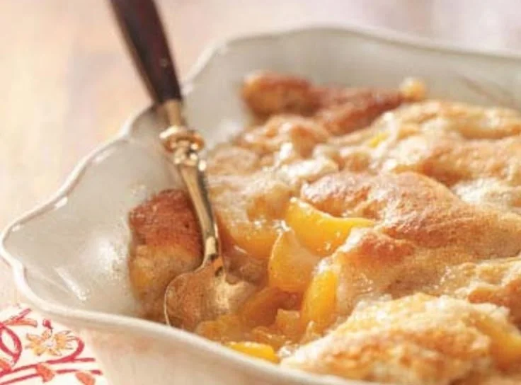 Delicious Tennessee peach pudding served in a rustic bowl.